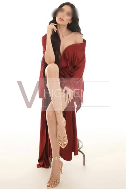Top model Sophie Marie is covered by a red robe