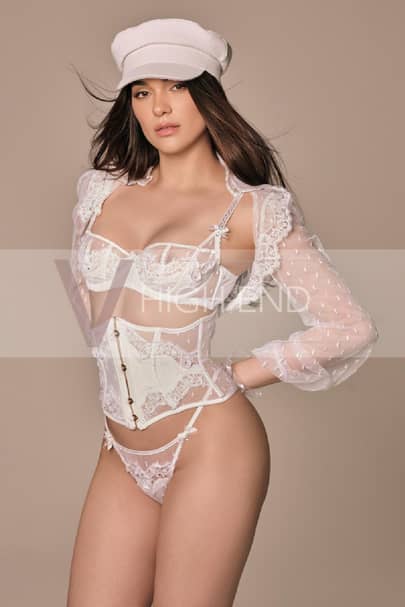 Sensual model Martina is dressed in a white lingerie set and a hat