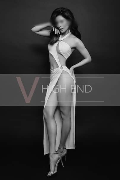 Full length photo of high-class London companion Ada wearing revealing dress
