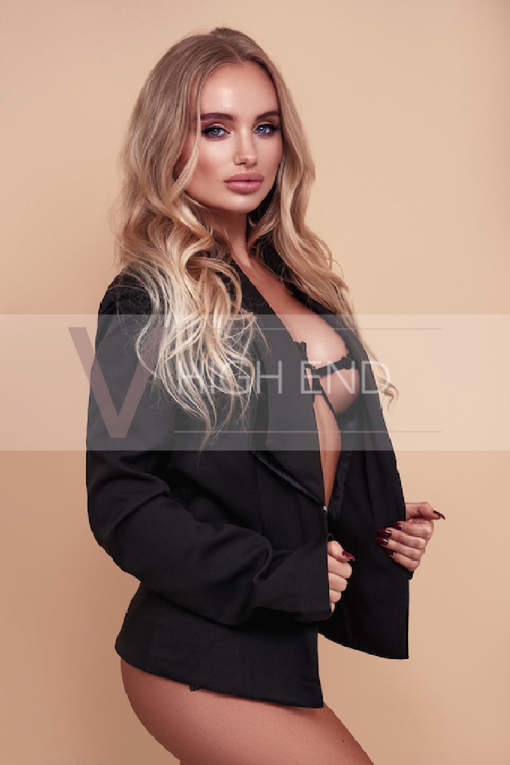 Glamour model Evelina is wearing smart black jacket