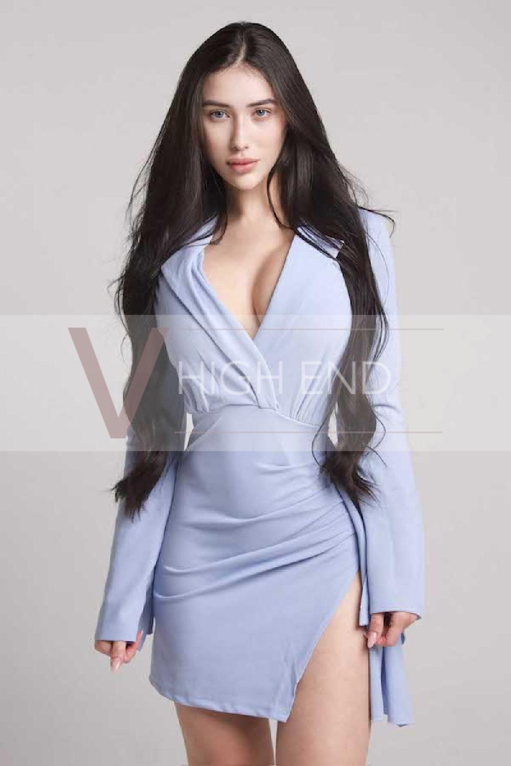 Sensual brunette woman Paulina is wearing blue body tight dress 